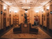 A lift lobby in an older building, where ageing lifts face a repair, modernise or replace decision