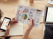 Great PPC and SEO Partners Are Built on Industry-Specific Experience: marketing specialists reviewing SEO and campaign analytics charts at a desk